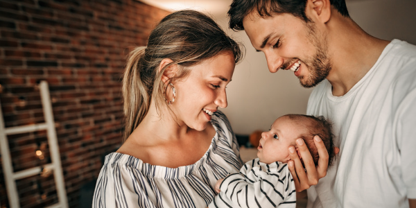 Photo of woman, baby, and man - a family
